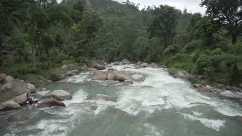 The flow of river water during the monsoon in the Himalayan hills Video stock 156298375