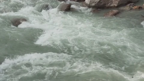 The flow of river water during the monsoon in the Himalayan hills Video stock 156298600