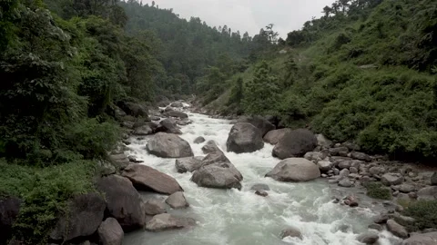 The flow of river water during the monsoon in the Himalayan hills Stock Footage 156298818