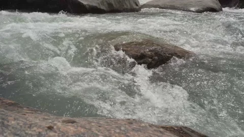 The flow of river water during the monsoon in the Himalayan hills Video stock 156344500