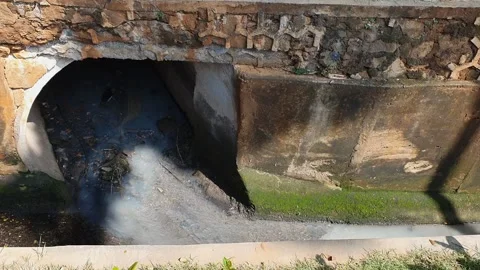 Flow of water along the big open channel city drainage system Stock Footage 279295183