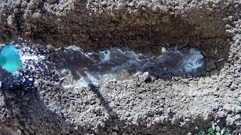 The flow of water on the bed of the earth Stock Footage 78050230