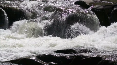 The flow of water is broken on the rocks. close-up Stock Footage 41257488