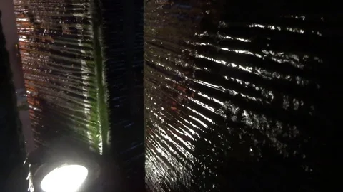 The flow of water on a dark wall Stock Footage 95690419