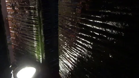 The flow of water on a dark wall Stock Footage 95690447