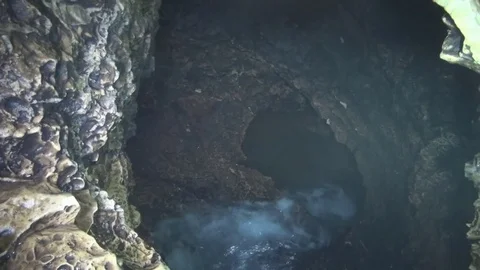 The flow of water down into the cave Stock-Footage 69981892