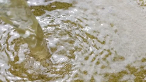 The flow of water flowing over the surface of an object, close up view shot Stock Footage 317125934