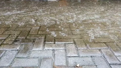 The flow of water flowing on the road with rainy conditions Stock Footage 231600892