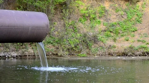 The flow of water spilling from the pipe Stock Footage 75469197