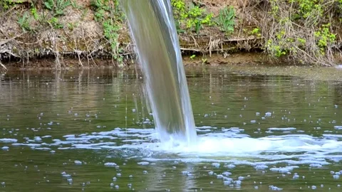 The flow of water spilling from the pipe Stock Footage 75469498