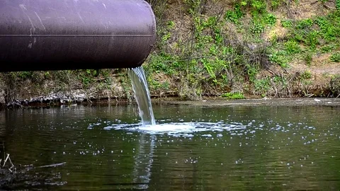 The flow of water spilling from the pipe Stock Footage 75469812