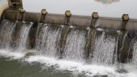 Flow of water through the dam Stock Footage 107744285
