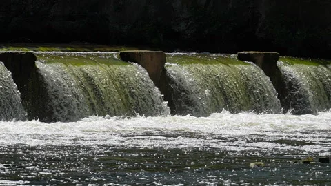 Flow of water through the spillway of a dam, 8x slow motion Video stock 325748500