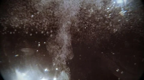 Flow of White Bubbles Rises to Cloud on Top of Glass Tableware in Darkness Stock Footage 61312461