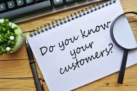  flower and notebook written with DO YOU KNOW YOUR CUSTOMER? Stock Photos