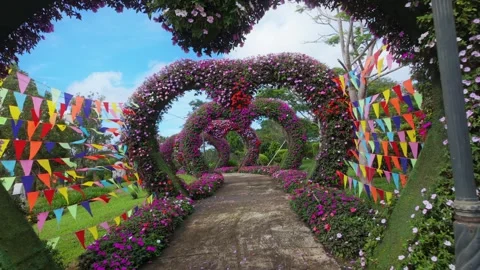 Flower arches and flags in a park in Da Lat, Vietnam Stock Footage 334633720
