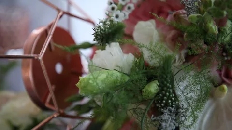 Flower Arrangement Next To a Copper Frame Stock-Footage 114883206