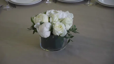 Flower arrangement on a table in a restaurant Stock Footage 155380824