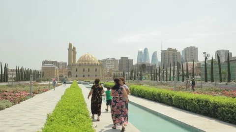 Flower bed in front of the mosque Tezepir. View of Baku through the landscape. Stock Footage 123530544