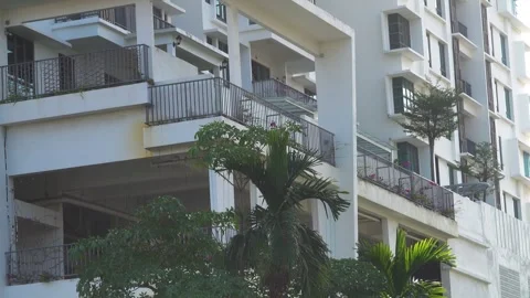 Flower beds, groves on balcony of multi-storey residential building Video stock 331436906