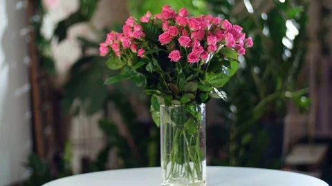 Flower bouquet in the rays of light, rotation, the floral composition consists Stock Footage