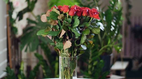 Flower bouquet in the rays of light, rotation, the floral composition consists Stock Footage