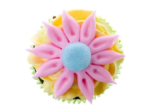 Flower candy on the top of cupcake Stock Photos