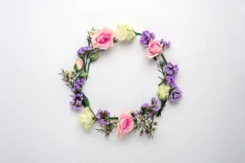 Flower circle, frame on white background, composition of roses, limonium, eus Stock Photos