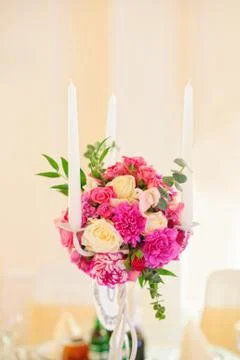 Flower composition with candles Stock Photos