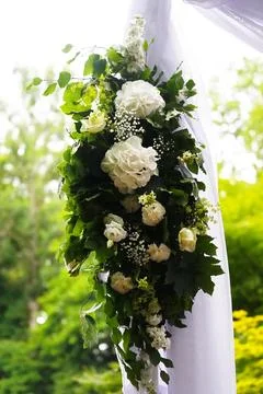 Flower composition consisting mainly of white hydrangeas and roses, as well.. Stock Photos