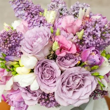 Flower composition with lilac and eustoma flowers Stock Photos