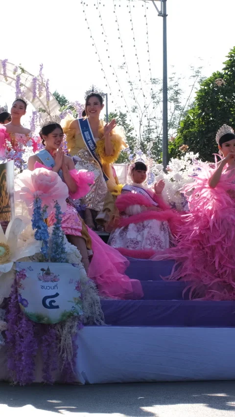 Flower decorated float with costumed riders Stock Footage 347666369