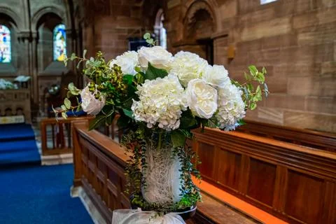 Flower decorations set inside a church Stock Photos