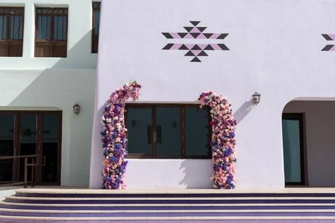 Flower Frames on Lavender Building with Light Green Architecture  Stock Photos