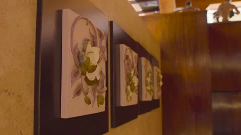 Flower Frames on a wall for decoration inside luxury home. sliding shot Vídeos de archivo 134665959