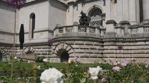 A flower garden in front of an old building. Stock Footage 125698415