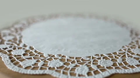 Flower on lace doily Stock Footage 48855498