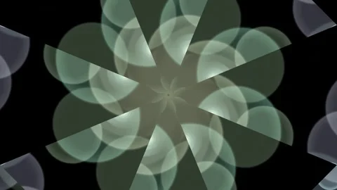 A flower-like pattern in motion against a dark background with green translucent Stock Footage 328805589
