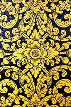 Flower pattern in traditional thai style art painting on window of the temple Stock Photos