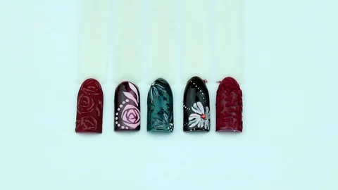 Flower patterns on manicure templates Stock Footage 76855791