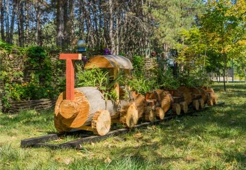 Flower pot in the form of a train made of wood 写真素材