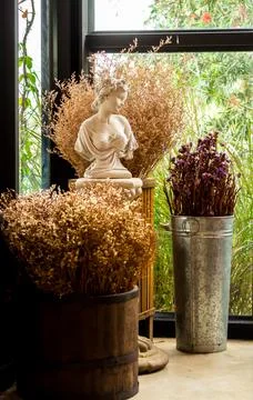 Flower pot style Gothic on table with dry flower bouquet. Stock Photos