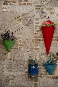 Flower pots hanging on a wall Stock Photos
