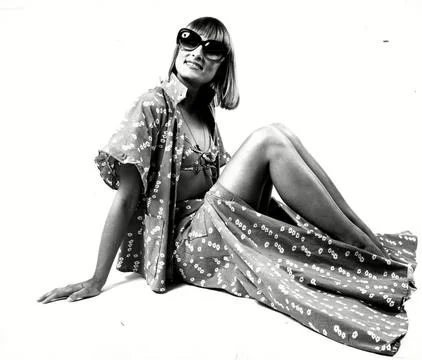 Flower-printed Bikini With A Matching Long Button Skirt And A Loose Floaty Jacke Stock Photos