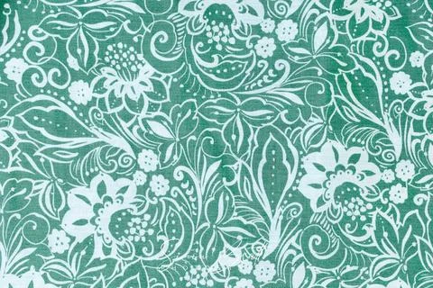 Flower scroll pattern on olive green material Stock Photos