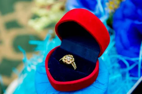 A flower shape diamond ring inside a case Stock Photos