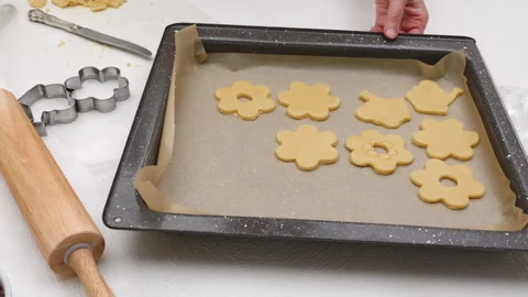 Flower shaped shortbread cookies filled with raspberry jam recipe. Stock Footage 146304982