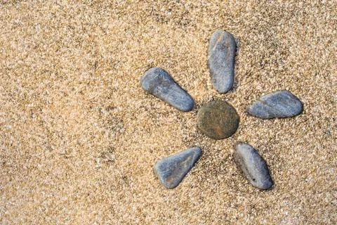 Flower shaped stonework set in stone pavement Stock Photos
