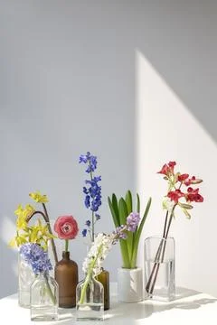 Flower vases on a white table Stock Photos