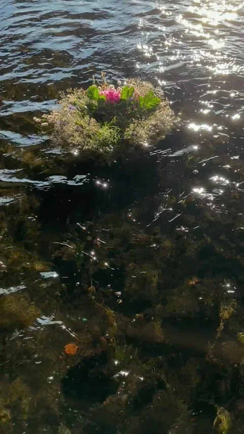 Flower Wreath on Water River. Midsummer Solstice Holiday concept Stock Footage 281147252